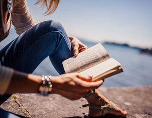 woman reading paperback